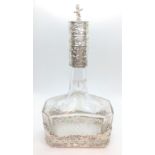 Large continental chased silver and glass scent bottle with stopper. Circa 1900.