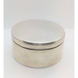 A Russian silver circular box with screw on cover. Mark to base. 8cm diameter. 122gms.