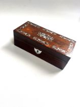 Rosewood box. Circa 1860. Of rectangular for. With mother of pearl inlay.