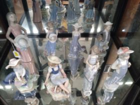 Seven Lladro figures of girls and one boy 19cm to 25.5cm high (8)