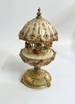 A Modern Merry go round music box. In gilt metal.