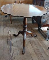 An antique mahogany tilt-top table with piecrust top. 76cm x 70cm x 70cm.