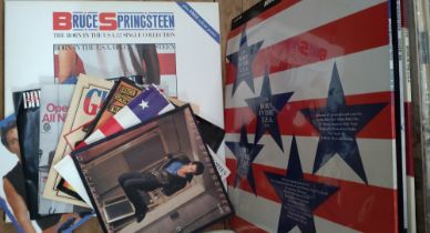 A collection of 7" & 12" singles and albums by Bruce Springsteen. 7" singles: Dancing in the Dark,