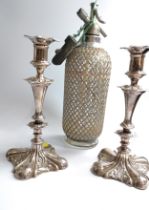 A pair of candlestick/ syphon