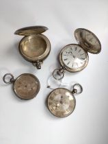 Four silver pocket watches.