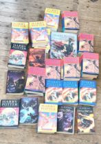 A collection Of Harry Potter Paper back and Hard back Novels. Some with dust covers. Some first