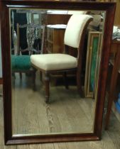 A mahogany rectangular bevelled mirror. 100cm x 71cm x 45cm.