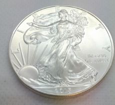 A 2015 fine silver American dollar. 31.4 gms.