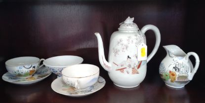 An Oriental teapot, jug, bowl and two teacups and saucers (chip in rim of jug)