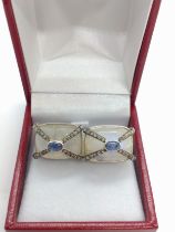 A large pair of moonstone, sapphire and diamond cufflinks set in silver, boxed. Rectangular