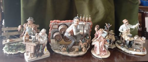 Five Capodimonte figure groups 16cm to 25cm high and a figure of a clock repairer 17.5cm high (6)