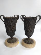 Two bronze urns.