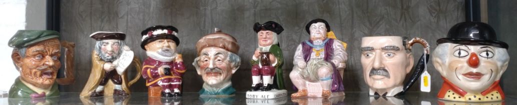 Eight character jugs including Gibsons Neville Chamberlain, Sandland Toby Ale and Beefeater 14cm
