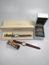 Three Burberry ladies wristwatches (one with box) together with a DKNY ladies cocktail watch with