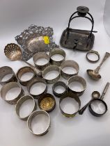 A small group of various silver plated items, to include napkin rings, spoons, sifter spoon, etc.