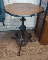 A Victorian tripod table. 64cm x 48cm.