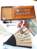 A Mahjong set and dice, together with a corkscrew, and three fans of various designs. (qty)