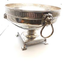 A George V silver rose bowl, embossed with lions head and swag drapers, with fluted decoration to