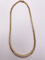 An 18ct yellow gold and diamond collar necklace, the curved bar pave-set with round brilliant-cut