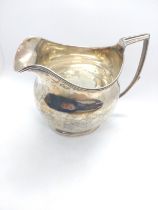 A Georgian silver cream jug, of plain form, dated 1806, 9cm high.