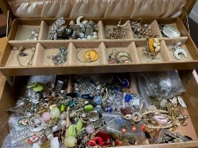 A box of costume jewellery to include various pairs of earrings, brooches, parts of jewellery etc.