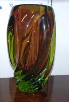 A Murano 1960's green and orange swirling oviform glass vase. 16.5cm.