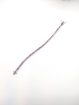 An 18ct white gold and pink sapphire bracelet, set with square-cut sapphires of approximately 5.0