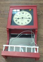 A clocking-in clock (electrical, no plug). Has been repainted.