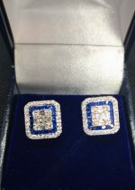 A pair of 18ct white gold square earrings set with sapphires and diamonds, boxed. Sapphires 2.