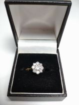A yellow gold and diamond floral cluster ring, set with round brilliant-cut diamonds, of