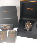 A gentlemen's Mido automatic day/date on a stainless steel bracelet with original box and papers.