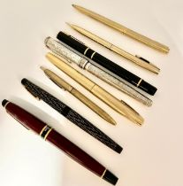 A group of eight pens, to include two Waterman examples, a silver plated Links of London pen, four