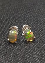 A pair of cabochon Ethiopian black opal studs in silver.