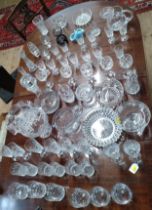 Sets of cut-glass wine glasses, sherry glasses, port glasses, tumblers, four jugs, seven bowls, a