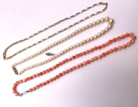 A 9ct bi-coloured link necklace, the yellow and white gold baton links connected with curb links,