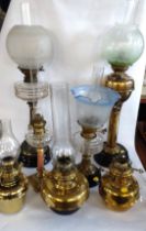 A group of seven various Victorian oil lamps. (one lacking shade). Tallest 76cm