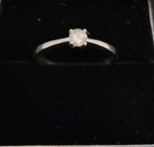 A 14ct white gold round brilliant cut diamond solitaire ring, boxed. Diamond 0.18ct.