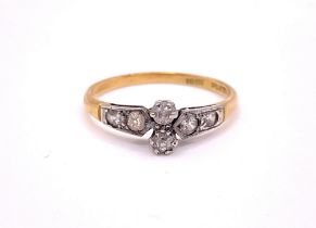 An early 20th century 18ct yellow gold and diamond ring, set with two old-cut diamonds, each