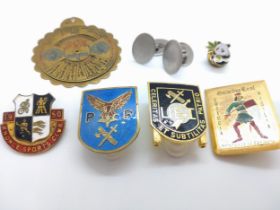 A collection of costume jewellery including cuff links, pendant and badges, some enameled.