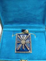 A stylish silver-gilt dark blue enamel pendant set with rose-cut diamonds on a gold plated silver