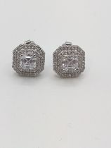 A pair of octagonal double halo studs set with cubic zirconia.