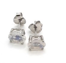 A pair of moonstone studs in silver.