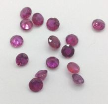 A parcel of fifteen unmounted round-cut rubies, 2.70ct.