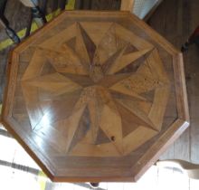 An octagonal table with marquetry. 74cm x 56cm