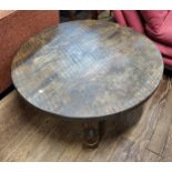 A large round oak coffee table. 40cm x 100cm diameter.