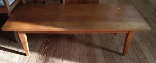 A teak coffee table. 38cm x 128cm x 52cm