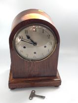 An oak mantel clock with Westminster chime