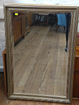 A modern gilt framed bevelled mirror. 98cm x 66cm