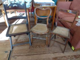 Three wicker seated chairs