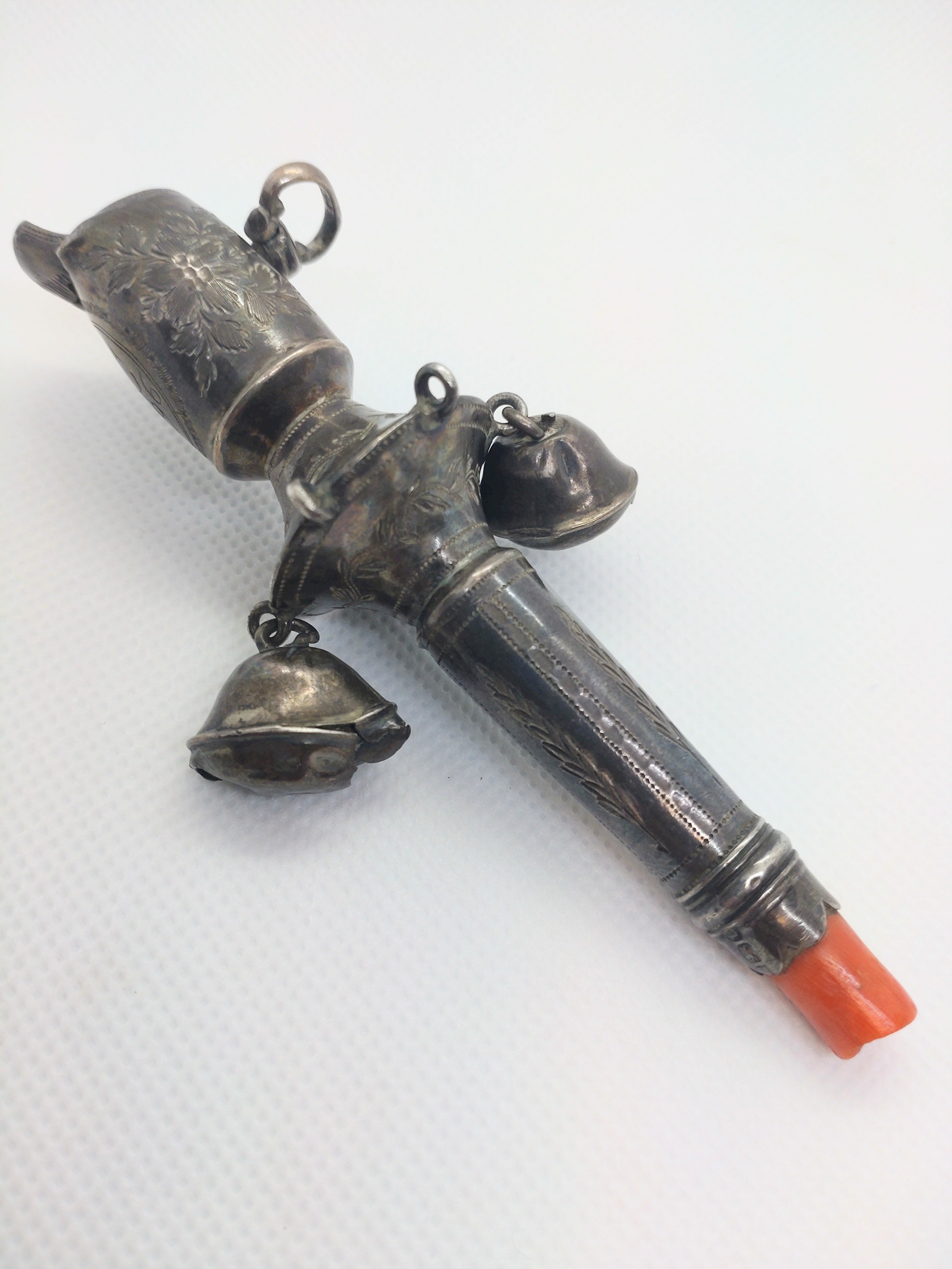 A George III sterling silver child's rattle with whistle. Engraved with the initials B.I.C 1796. A